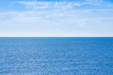 Obraz premium Calm sea with clear sky in background - concept image with copy space