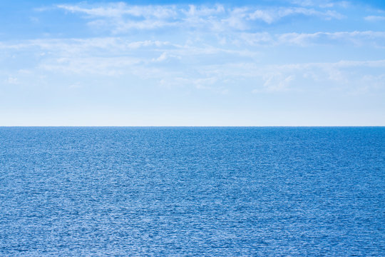 Calm sea with clear sky in background - concept image with copy space