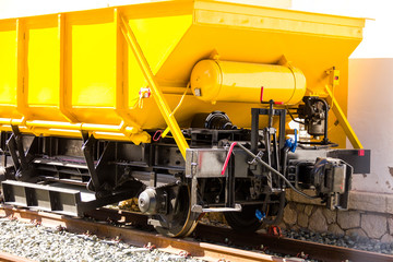 Ballast train. A large cargo yellow train at the station