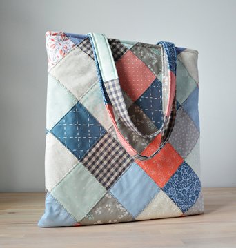 Quilted tote bag on the wooden table