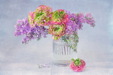 Close-up floral composition with a pink Ranunculus flowers . Beautiful bouquet of a spring flowers.