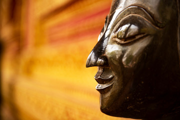 The Buddha face used as an amulet of Buddhism in Asia.