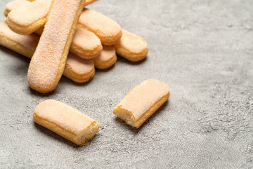 Italian Savoiardi ladyfingers Biscuits on concrete backgound