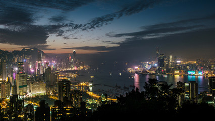 Hong Kong skyline at twilight. High view overlooking Victoria Harbor including both Hong Kong island and Kowloon - 251803350