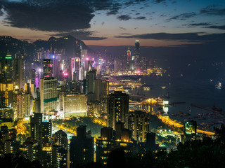 Hong Kong skyline at twilight. High view overlooking Victoria Harbor including both Hong Kong island and Kowloon - 251803371
