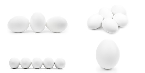 Isolated set of white whole chicken eggs on white background. Realistic natural photography with shadow. Raw chicken eggs close up. Cut off