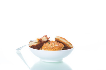 fried chicken cutlets in a white bowl