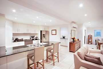 Sofa set near sink and pantry cupboard