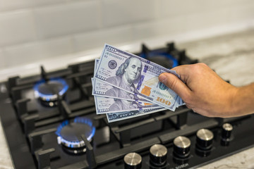 Gas hob cooktap with burning natural gas US dollar.