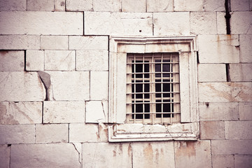 Fototapeta na wymiar Stone wall deeply cracked with window - concept image background