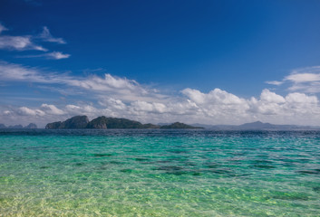 Fototapeta na wymiar beach, sea shore with sand and blue water.