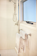 Towel hanging on a silver pipe hanger