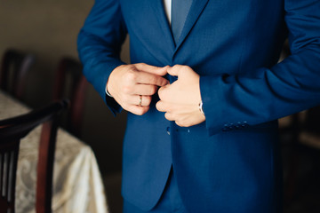 the groom in a wedding suit, a man preparing for the wedding 1