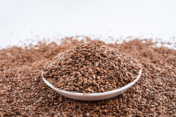 Flax seeds on white background