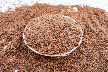 Flax seeds on white background