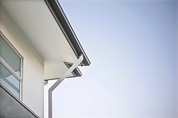 House roof and ceiling with drain pipe