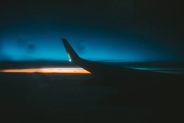 Fototapeta na wymiar Dramatic sunrise, view from the airplane