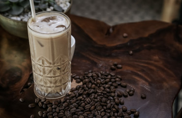 Iced coffee in a tall glass. Iced cafe latte or cappuccino