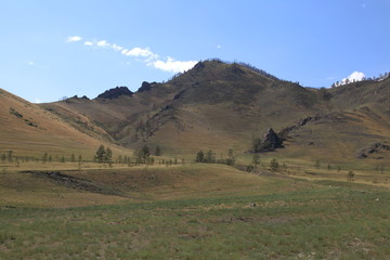 The mountains of the Barguzin mountains, this valley of the Barguzin river Steppe in the floodplain of the Barguzin river, then-birch forest belt, and behind it-the mountains of Barguzin ridge and the