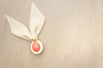 Easter bunny (rabbit) egg concept, table arrangement decoration. Pink (rosy) eggs with vintage...