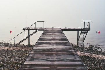 Naklejka premium Boat dock on Lake Constance with a view of the Alps