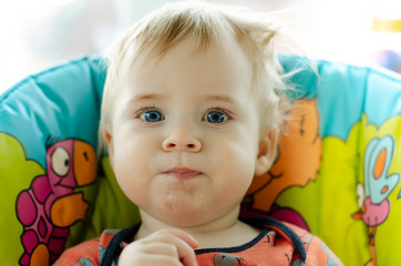 small blond boy is smeared in food