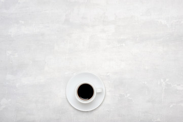 White cup filled with hot coffee.