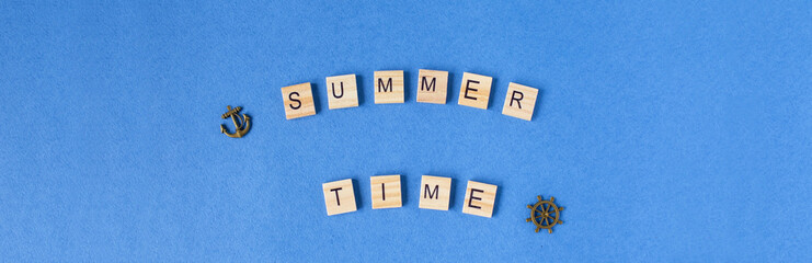 Phrase Summer time on a blue background, with sand painted. Summer background