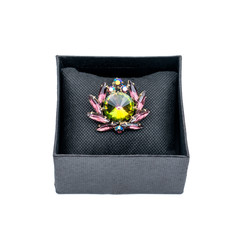 Vintage brooch in a black box on an isolated background