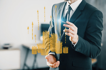 Double exposure with growth coins columns and man hand. Concept of success savings and capital.