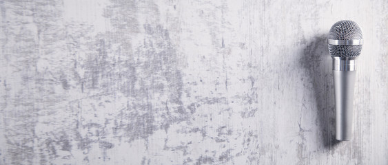 Microphone on a white desk. Top View