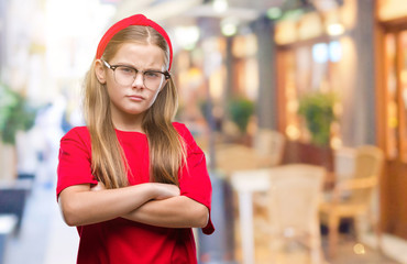 Young beautiful girl wearing glasses over isolated background skeptic and nervous, disapproving expression on face with crossed arms. Negative person.