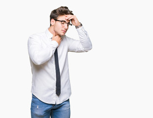 Young business man wearing glasses over isolated background Touching forehead for illness and fever, flu and cold, virus sick