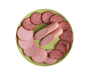 Sausage cut into pieces on a plate on a white background.