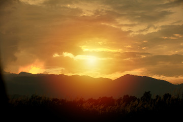 Orange sky from sun ray during sunset - sunrise, Dawn over the mountain