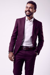 Fototapeta premium Brutal young African American male model in formal fashion suit