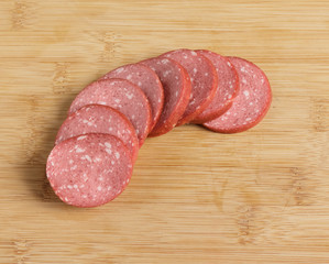 Sausage cut into pieces on the table.