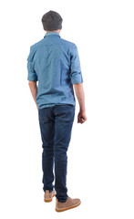 Back view of man in dark jeans. Standing young guy. Rear view people collection. backside view of person. Isolated over white background.