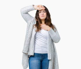 Beautiful plus size young woman wearing winter jacket over isolated background Touching forehead for illness and fever, flu and cold, virus sick