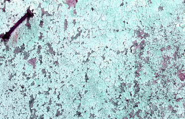 Old wooden background with remains of pieces of scraps of old paint on wood. Texture of an old tree, board with paint, vintage background peeling paint. old blue board with cracked paint, vintage