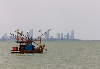 Fototapeta premium Thai wooden fishing boats at anchor near the shore