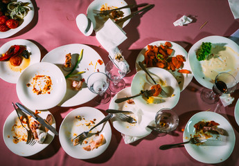 Dirty dishes on a table in a restaurant. After eating