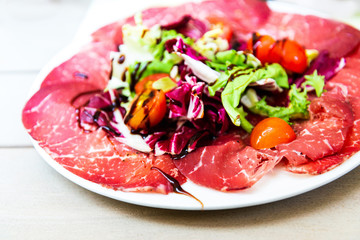 close up of tasty cold meats on the table