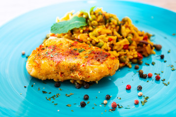 Andalusian fish, saffron rice with vegetables