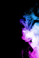 Vape clouds splash with two colours fog is blue and purple colour. Low light photo. Stock isolated on black background color smoke with spray boiling glycerine lines.