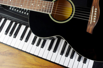 Acoustic guitar and piano keyboard.