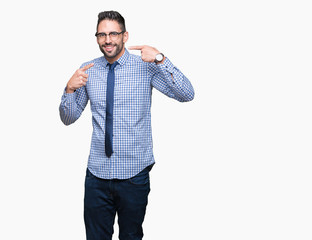 Young business man wearing glasses over isolated background smiling confident showing and pointing with fingers teeth and mouth. Health concept.