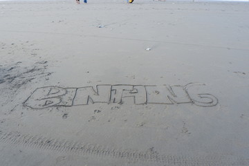 writing on the beach sand