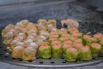 Closeup Dim Sum ,Chinese food steamed dumpling on stainless steel tray  background.