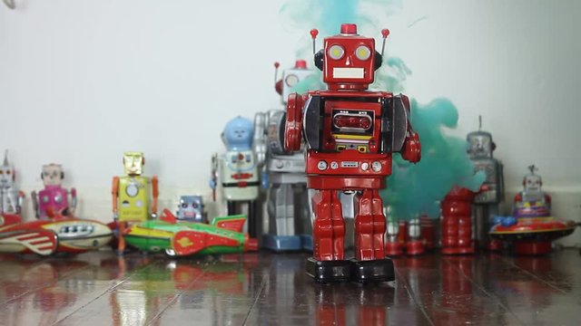 retro red  metal robot attack  with green smoke on old wooden floor 